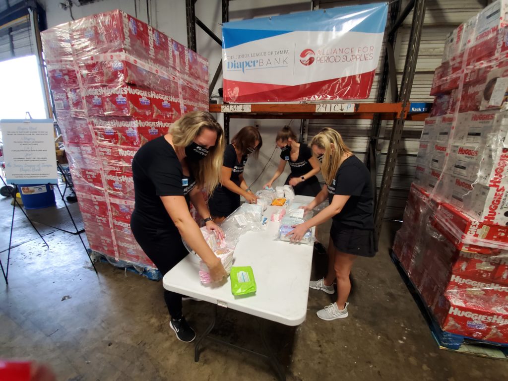 The Junior League of Tampa Diaper Bank Members pack diapers during COVID