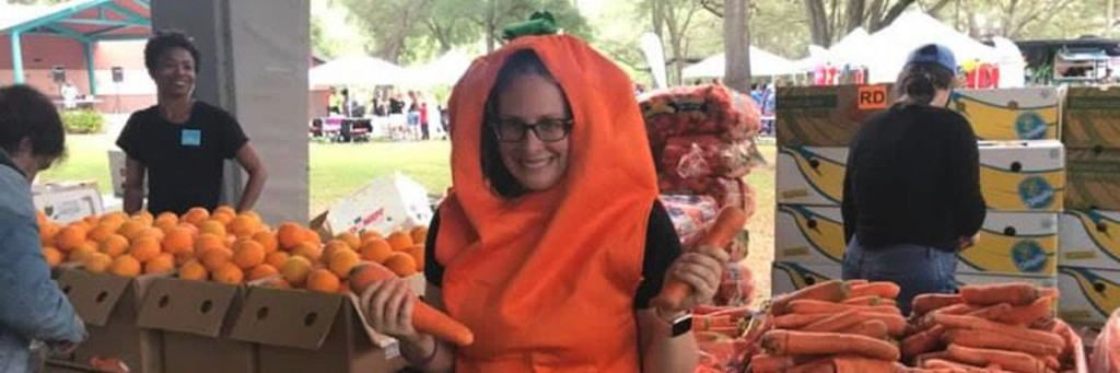 The Junior League of Tampa volunteer at food distribution