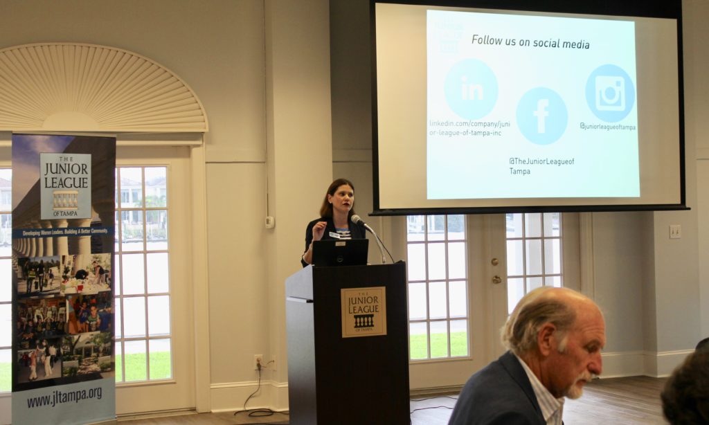 Junior League of Tampa President Isabel Dewey speaking at the Fall 2018 Community Advisory Board Breakfast